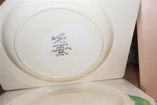 Three Clarice Cliff dishes and similar style napkin rings